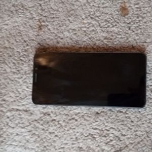 TCL phone and Skullcandy headphones